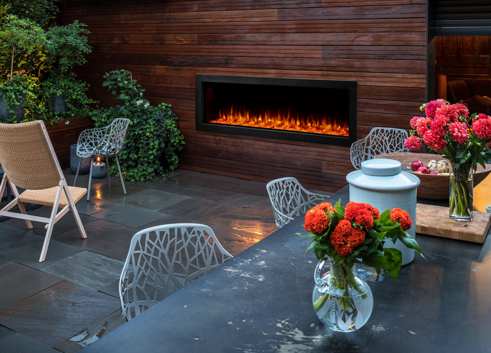 SimpliFire Forum 55" Outdoor Electric Fireplace in Backyard with Trim